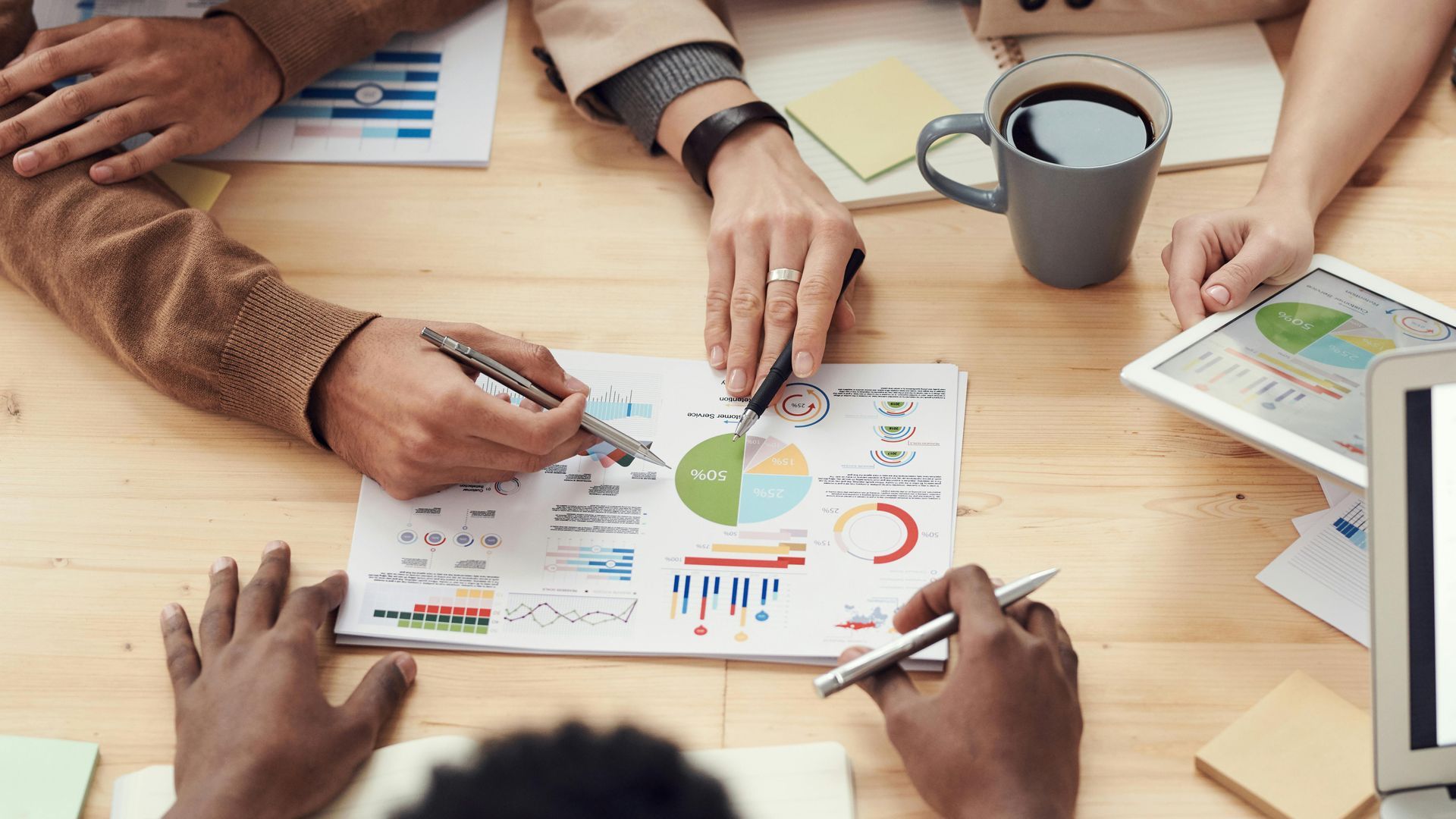 Business analytics team reviewing charts and data